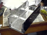 Front and back panels attached on the bottom panel assy