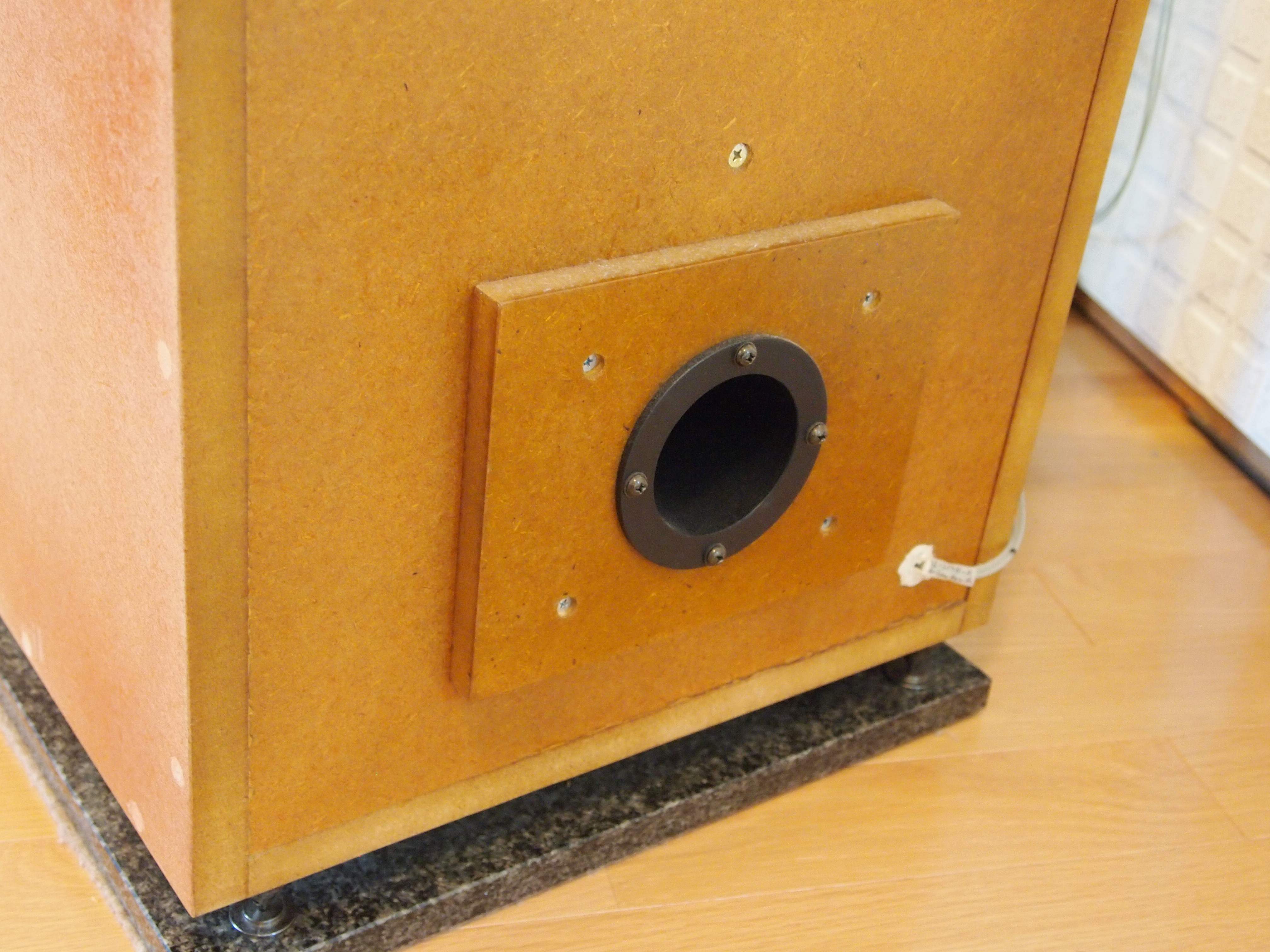 Bass-reflex port attached to woofer box